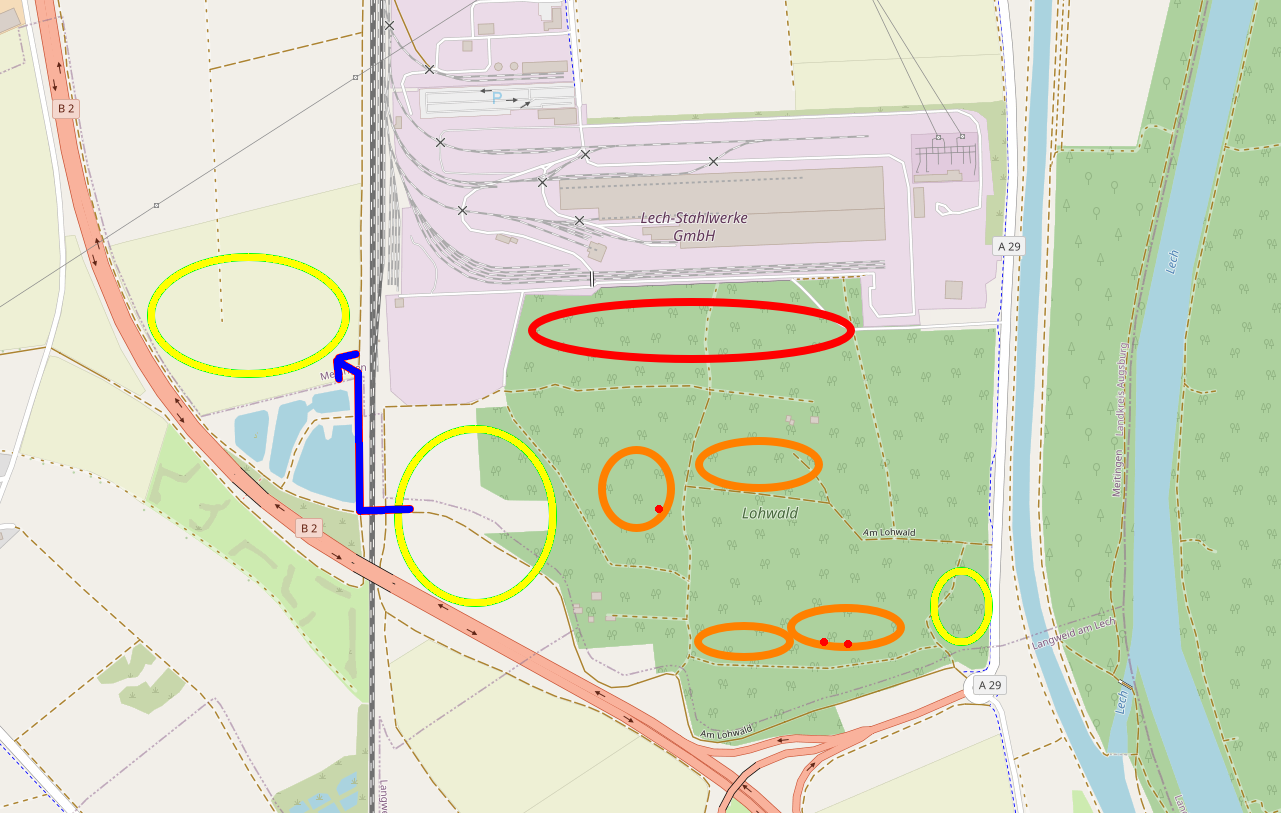 Der Lageplan zeigt auf einer Karte
       die Positionen von sogenannten Ausgleichs und Rodungsflächen.
       Von Norden nach Süden verläuft die Bahnlinie.
       Östlich davon befinden sich im Norden die Lech-Stahlwerke
       und im Süden der Lohwald sowie einige Ausgleichsflächen.
       Westlich der Bahnlinie gibt es Ausgleichsflächen auf Höhe des Stahlwerkes.
       Südwestlich davon verläuft diagonal von Nordwesten nach Südosten
       die Bundesstraße.
       Zwischen den Ausgleichsflächen westlich der Bahnstrecke und östlich der Bahnstrecke,
       gibt es nur eine Unterführung und einen dünnen Korridor,
       der zwischen Bundesstraße und Stahlwerk verläuft.